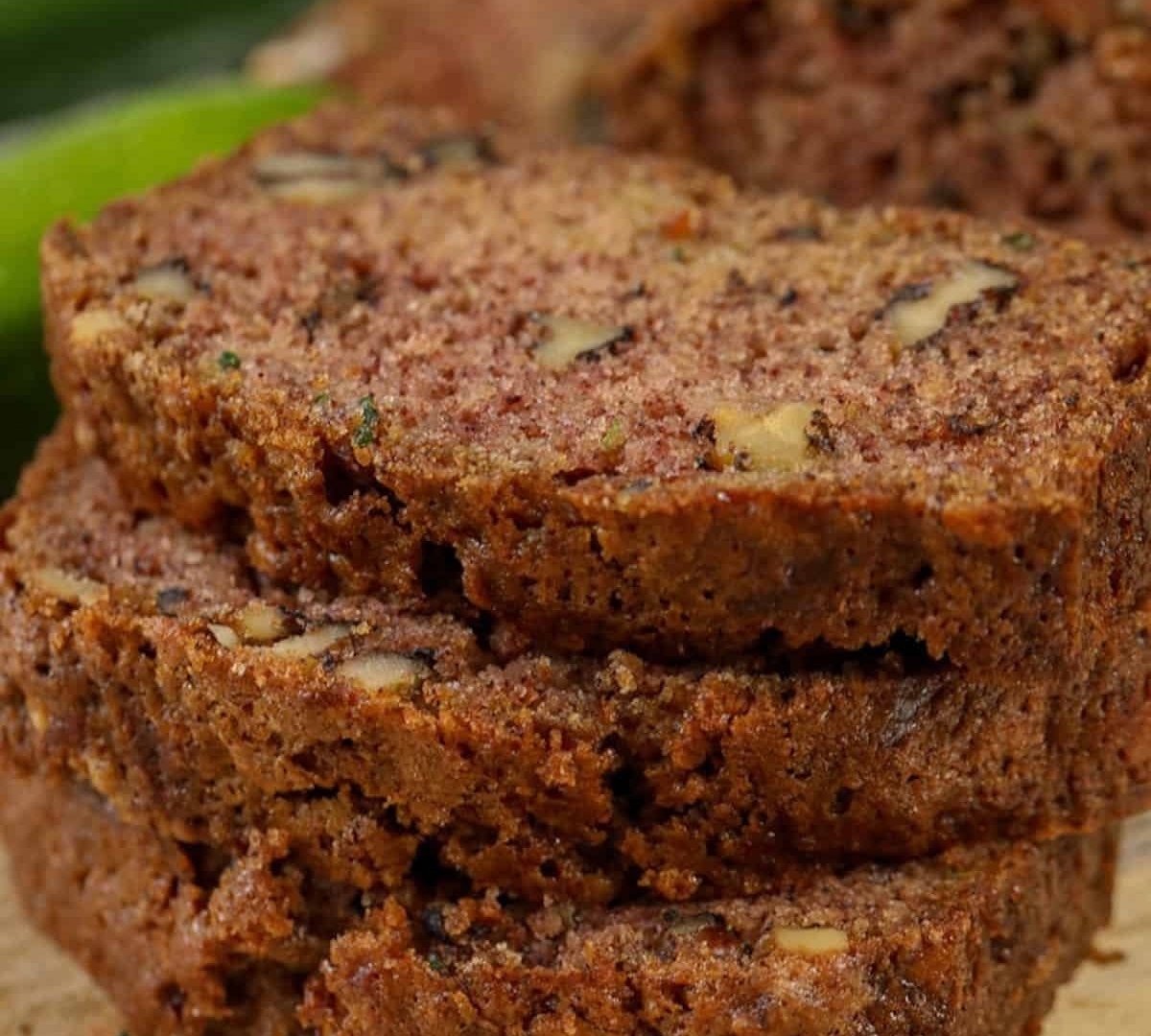 Slices of moist zucchini bread with walnuts